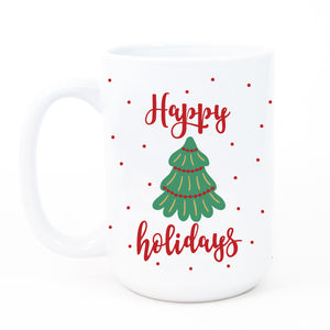 A festive Happy Holidays coffee mug featuring a vibrant Christmas tree graphic and bold red lettering, perfect for the holiday season.