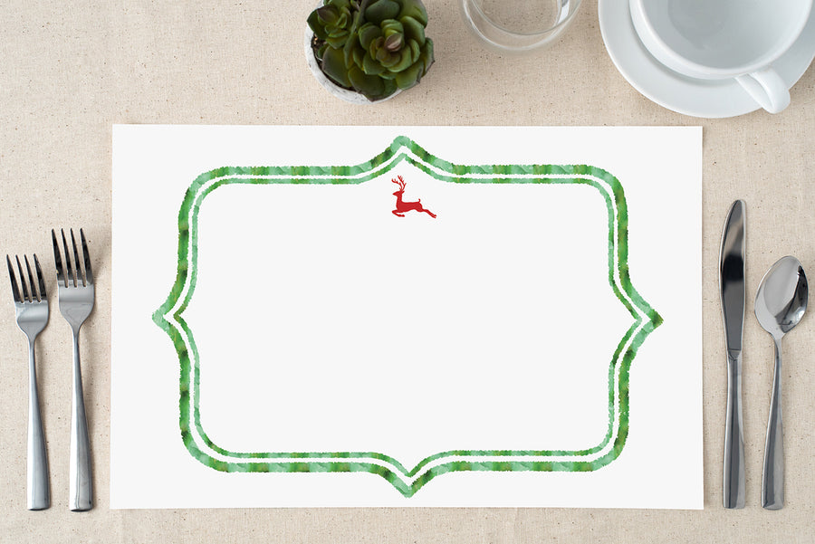 A pack of red reindeer Christmas paper placemats with a Christmas green border, showcasing elegant and festive boho design elements perfect for holiday dining.