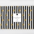 Load image into Gallery viewer, Elegant black and white striped placemat adorned with gold snowflakes and glitter like details.