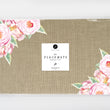 Load image into Gallery viewer, Pink vintage floral paper placemats, featuring rose design and burlap look, ideal for rustic dining and special events.
