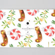 Load image into Gallery viewer, Holly Jolly Christmas Paper Placemats showcasing vibrant red and green hues, candy cane and peppermint patterns for festive table decor by Digibuddha.