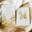 Load image into Gallery viewer, Baby in bloom shower invitation featuring yellow wildflowers, pastel hues, and sage green accents for a whimsical, gender-neutral celebration.