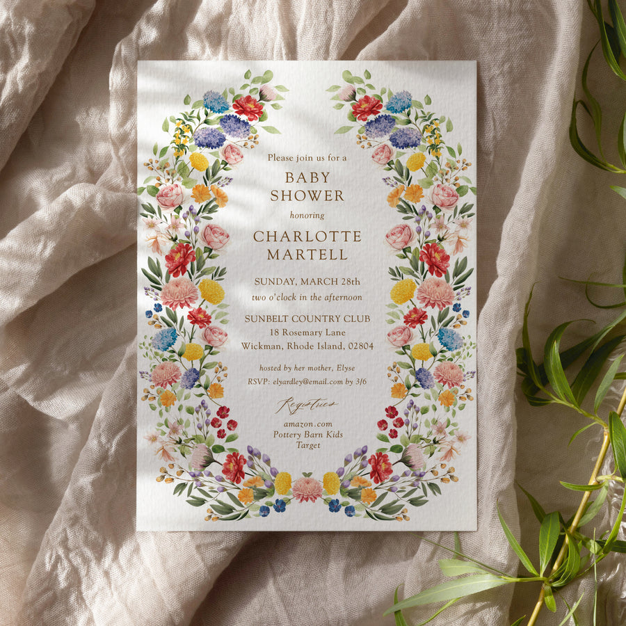 Colorful wildflower baby shower invitation card for garden theme celebration, blending purple, green, yellow, and pink florals, perfect for spring or summer boho-themed baby showers.