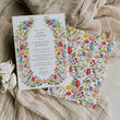Load image into Gallery viewer, Colorful wildflower baby shower invitation card for garden theme celebration, blending purple, green, yellow, and pink florals, perfect for spring or summer boho-themed baby showers.