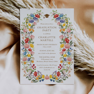 Floral pink wildflower graduation party invitation for 2024, featuring a colorful blend of pink, green, yellow, and purple flowers, perfect for celebrating a significant academic milestone in spring or summer