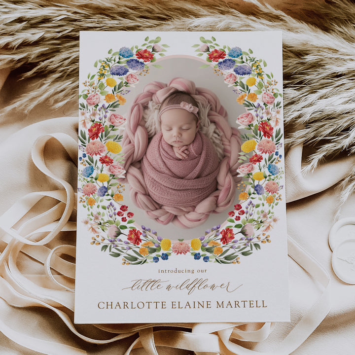 Boho floral birth announcement card for a new baby girl, featuring a flower wreath design and colorful wildflowers for spring and summer babies.