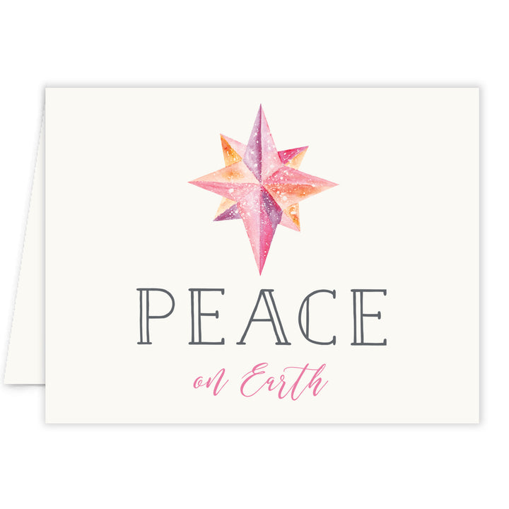 Boxed set of Pink Peace on Earth Christmas cards by Digibuddha, featuring festive pink design with bold snowflakes.