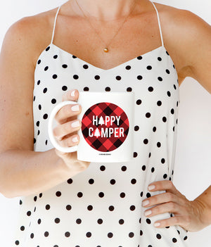 Happy Camper Coffee Mug with a vibrant red and black buffalo plaid design and an evergreen tree graphic, made from fine white ceramic.