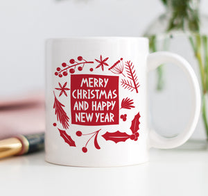Red and white Merry Christmas and Happy New Year coffee mug with mistletoe and festive design on fine white ceramic, top rack dishwasher safe.