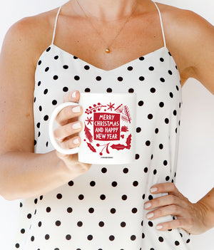 Red and white Merry Christmas and Happy New Year coffee mug with mistletoe and festive design on fine white ceramic, top rack dishwasher safe.