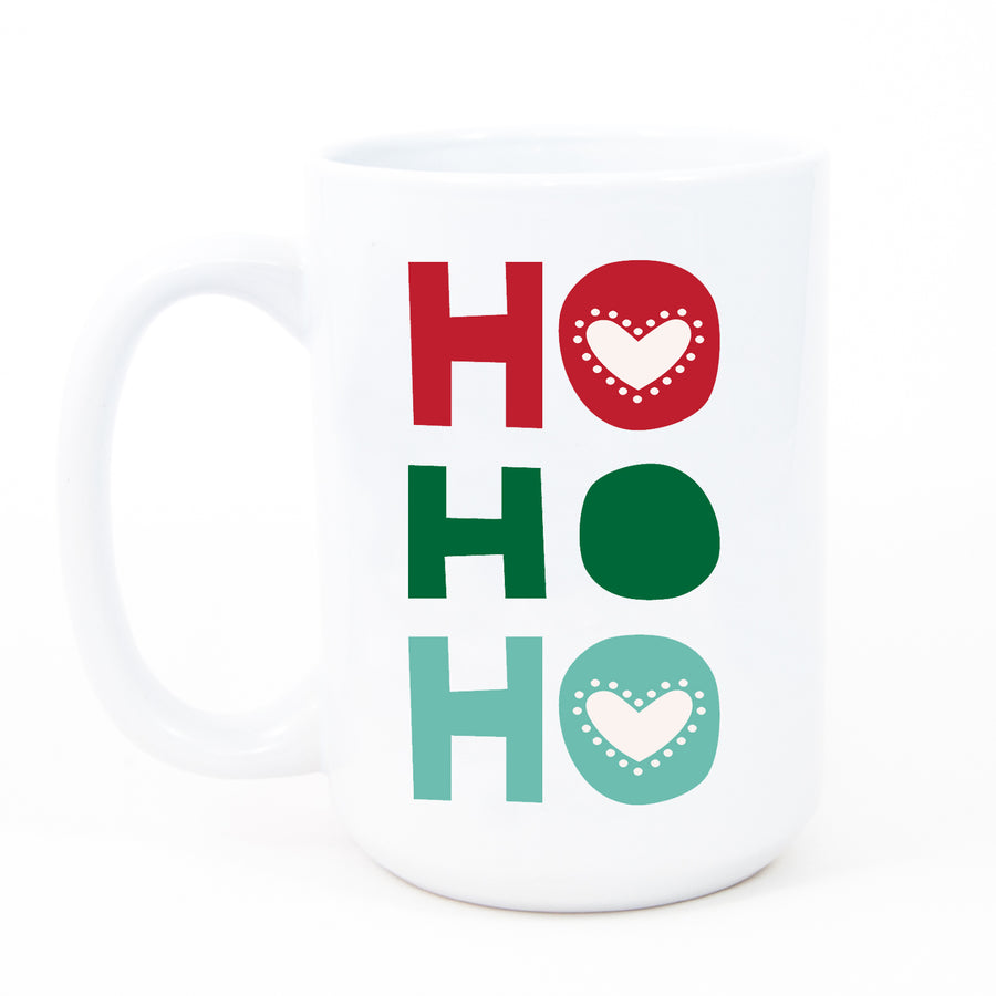 Vibrant green and red “HO HO HO” merry Christmas mug on a white ceramic mug with a glossy finish by Digibuddha.