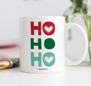 Vibrant green and red “HO HO HO” merry Christmas mug on a white ceramic mug with a glossy finish by Digibuddha