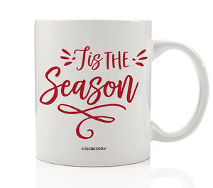 Tis the Season Coffee Mug by Digibuddha, featuring 'tis the season written in red festive script on a white glossy ceramic mug.