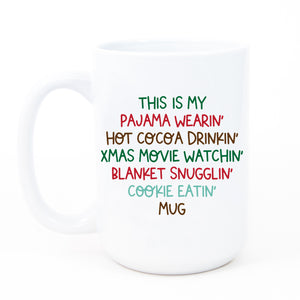 Vibrant and fun Christmas mug with humorous text in festive hues of reds, greens, browns, and blues, perfect for movie lovers and hot cocoa drinkers.