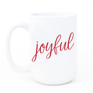 A Joyful Christmas coffee mug with festive, red, modern, minimalist letters printed on fine white ceramic. Ideal holiday gift mug.