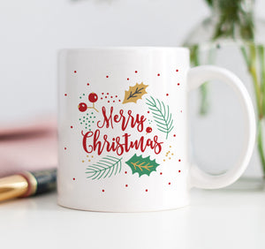 Vibrant red, white, and green Merry Christmas Holly Coffee Mug with a modern design of holly and evergreen, a perfect Christmas coffee mugs from Digibuddha.