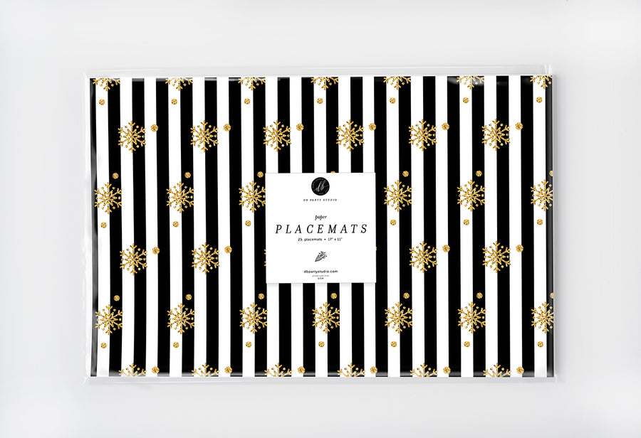 Elegant black and white striped placemat adorned with gold snowflakes and glitter like details.
