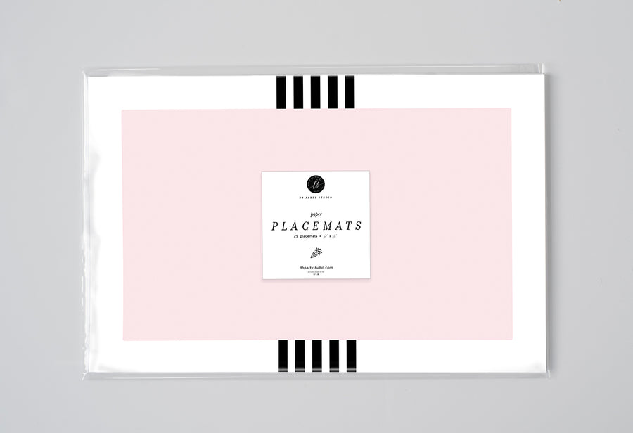 Blush pink black and white stripe paper placemats, perfect for modern dining, bridal showers, and chic outdoor table setting.