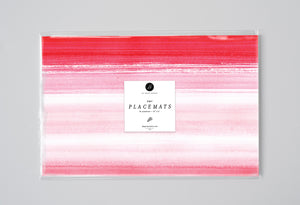 Ombre pink watercolor paper placemats, ideal for modern dining table decor, bridal showers, and chic outdoor gatherings.