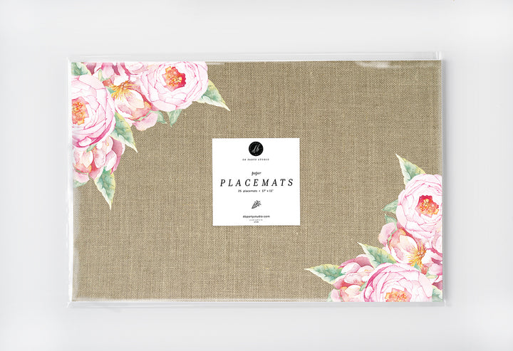 Pink vintage floral paper placemats, featuring rose design and burlap look, ideal for rustic dining and special events.