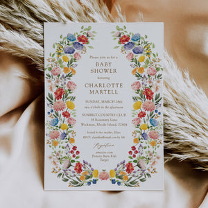 Colorful wildflower baby shower invitation card for garden theme celebration, blending purple, green, yellow, and pink florals, perfect for spring or summer boho-themed baby showers.