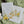 Load image into Gallery viewer, Gender neutral gender reveal party invitation featuring wildflowers in pastel yellow and sage green, asking &#39;he or she what will it be?
