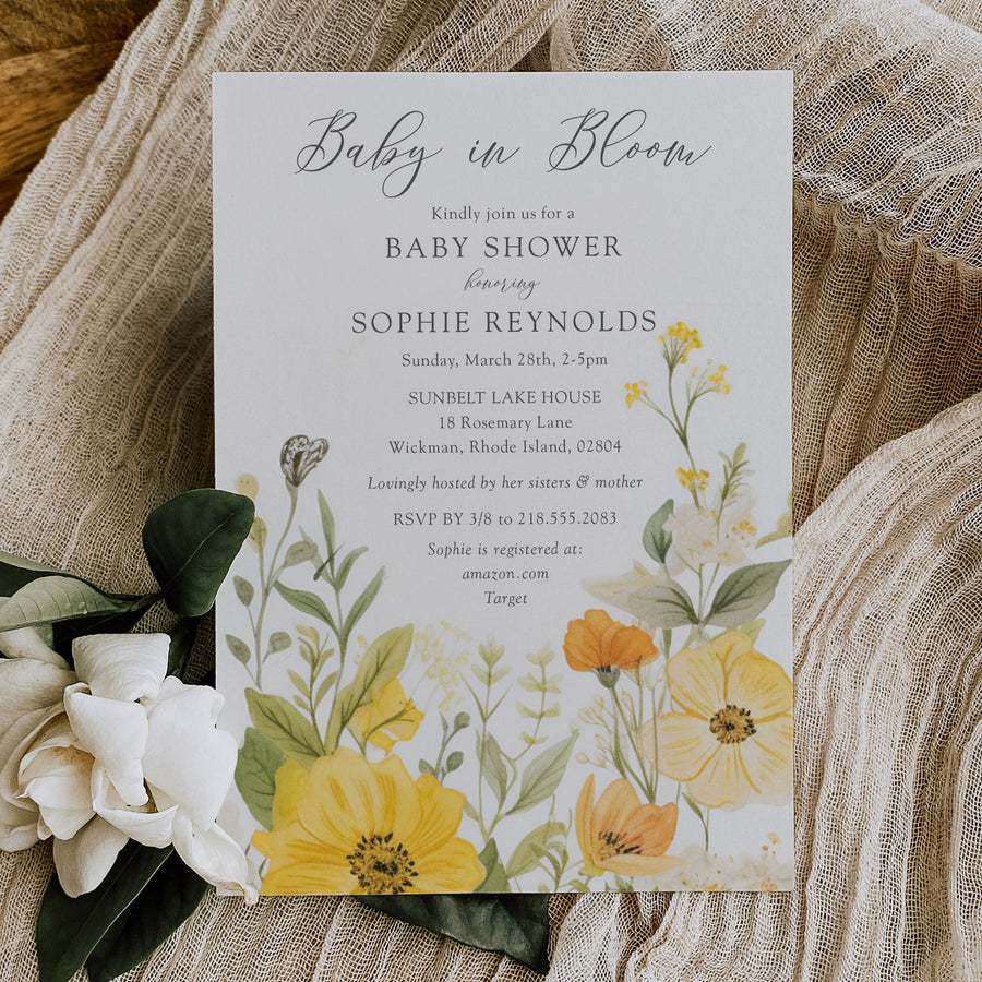 Baby in bloom shower invitation featuring yellow wildflowers, pastel hues, and sage green accents for a whimsical, gender-neutral celebration.