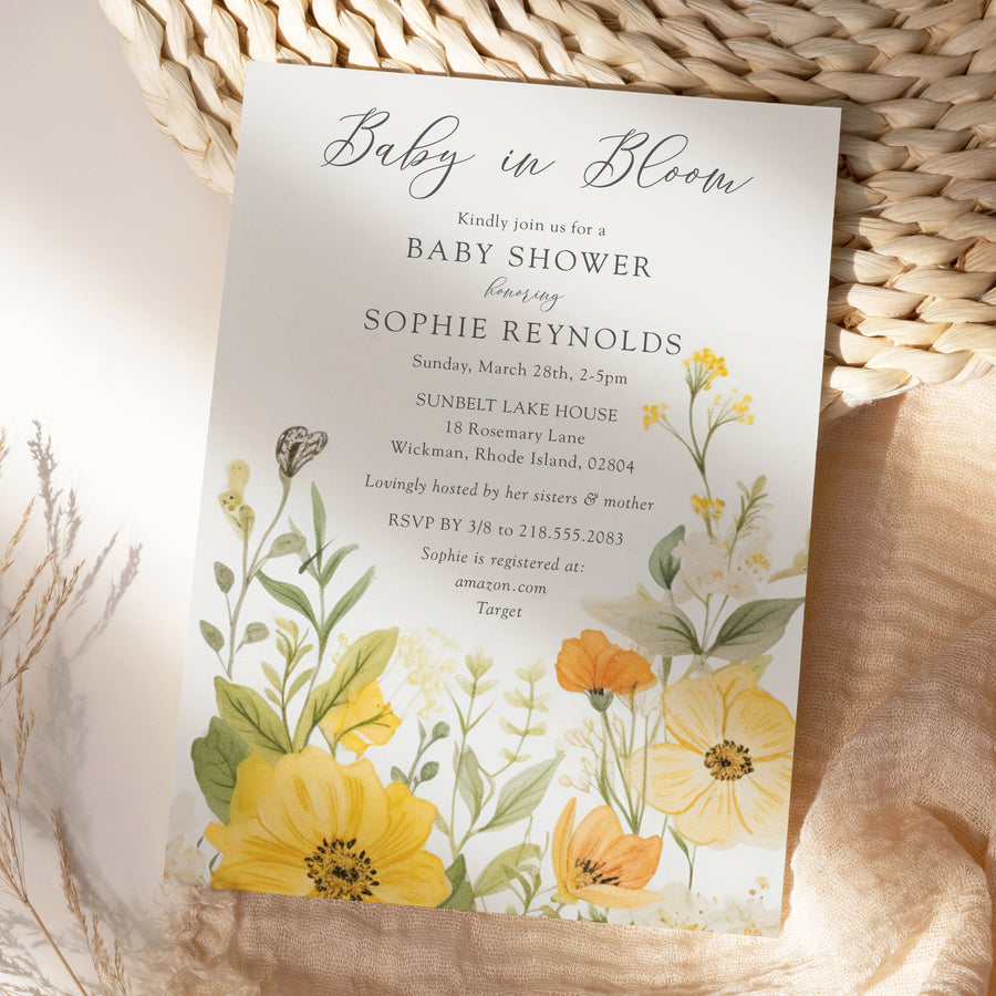 Baby in bloom shower invitation featuring yellow wildflowers, pastel hues, and sage green accents for a whimsical, gender-neutral celebration.