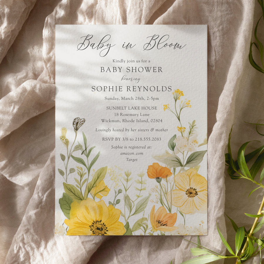 Baby in bloom shower invitation featuring yellow wildflowers, pastel hues, and sage green accents for a whimsical, gender-neutral celebration.