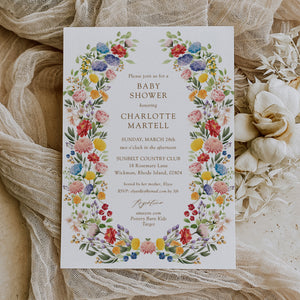 Colorful wildflower baby shower invitation card for garden theme celebration, blending purple, green, yellow, and pink florals, perfect for spring or summer boho-themed baby showers.