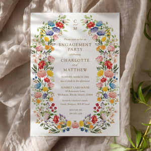 Elegant engagement party invitation featuring botanical greenery and floral designs, celebrating the couple's announcement