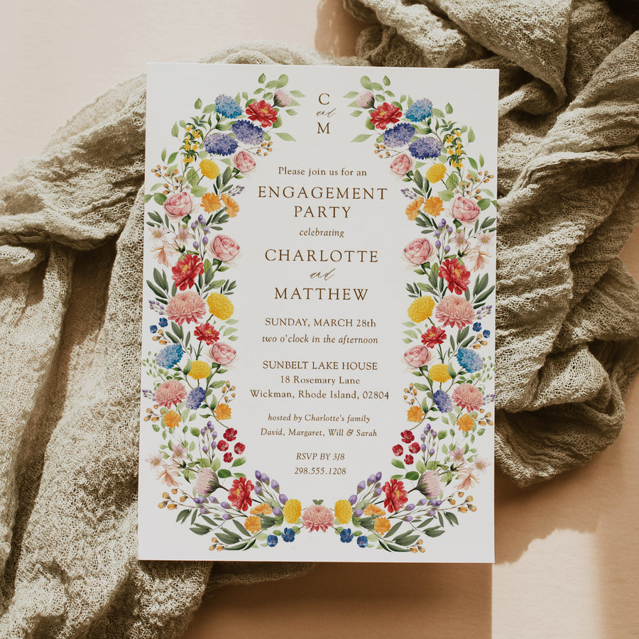 Elegant engagement party invitation featuring botanical greenery and floral designs, celebrating the couple's announcement