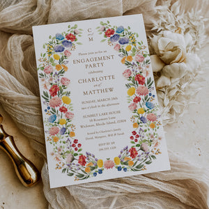 Elegant engagement party invitation featuring botanical greenery and floral designs, celebrating the couple's announcement