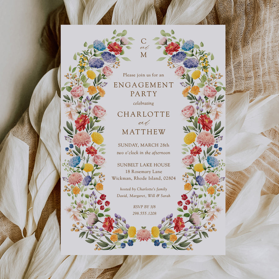 Elegant engagement party invitation featuring botanical greenery and floral designs, celebrating the couple's announcement