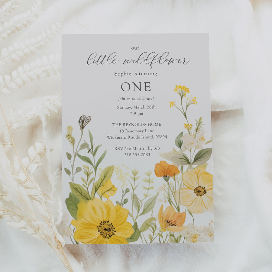 Floral 1st birthday invitation featuring sage greenery and yellow pastel watercolor wildflowers for a whimsical garden party celebration.