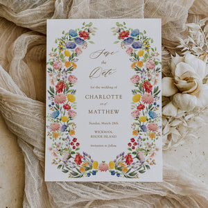 Elegant Save the Date card featuring a mix of greenery, wildflowers, and watercolor designs, perfect for announcing a spring or summer wedding.