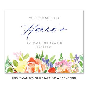 Elegant watercolor floral bridal shower invitations featuring bright florals and light greenery in purple, red, and green.