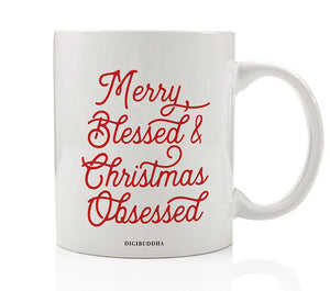 A white ceramic Christmas mug with Merry Blessed & Christmas Obsessed printed in red, festive script. Perfectly embodies the obsessed with Christmas spirit.